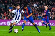 BARCELONA, SPAIN - JANUARY 26:  Luis Suarez of FC Barcelona scores his team's third goal past Inigo Martinez of Real Sociedad de Futbol during the Copa del Rey quarter-final second leg match between FC Barcelona and Real Sociedad at Camp Nou on January 26, 2017 in Barcelona, Spain.  (Photo by David Ramos/Getty Images)